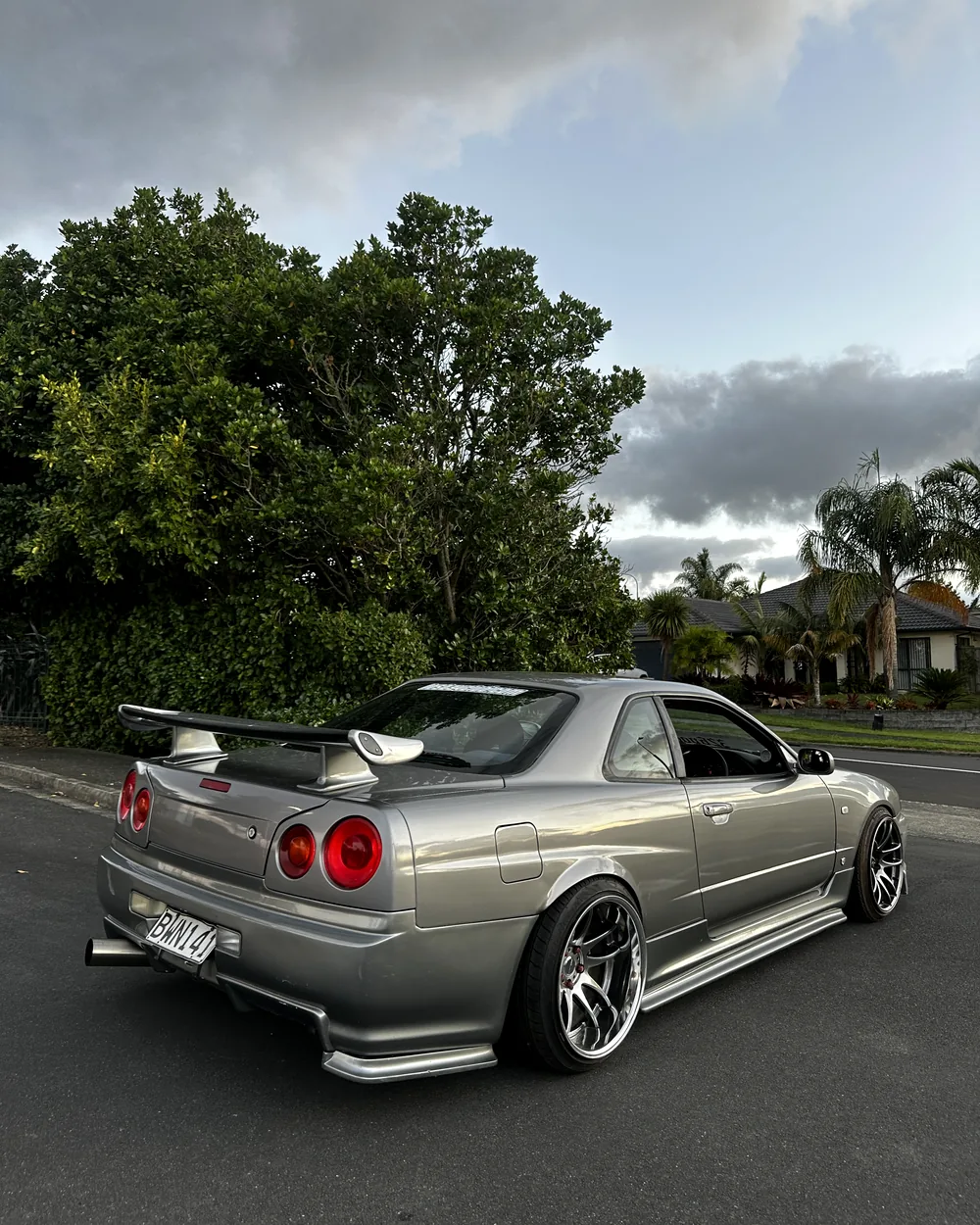 Nissan Skyline R34 rear three quarter showing 18x11 -20 rear fitment